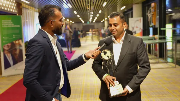 Post-award media interview holding the SMEDA trophy